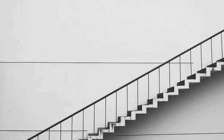 a set up stairs going up on a white background